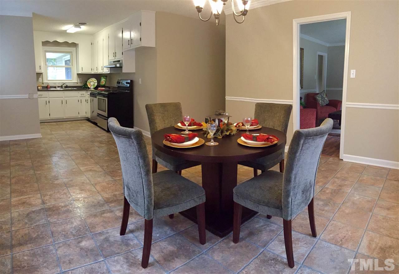 706 Chandler Road Durham, NC 27703 - Photo 8 of 24 a view of a dining room with furniture