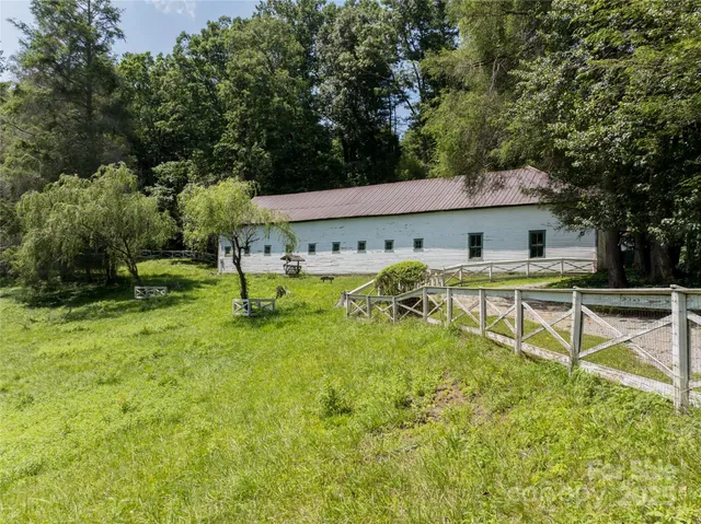 a swimming pool with outdoor seating and yard
