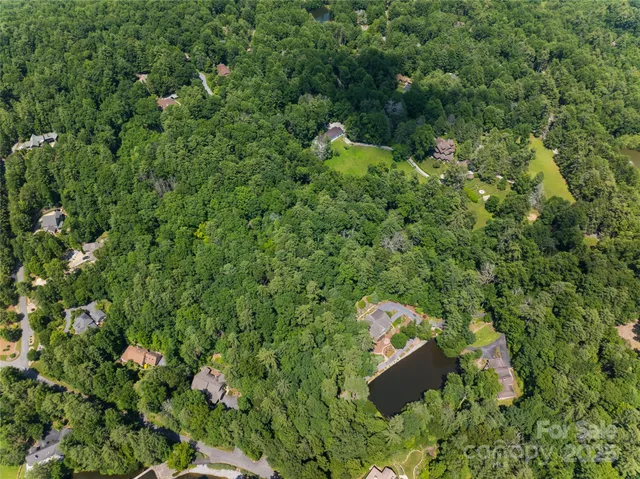 a backyard of a house with a yard and fountain