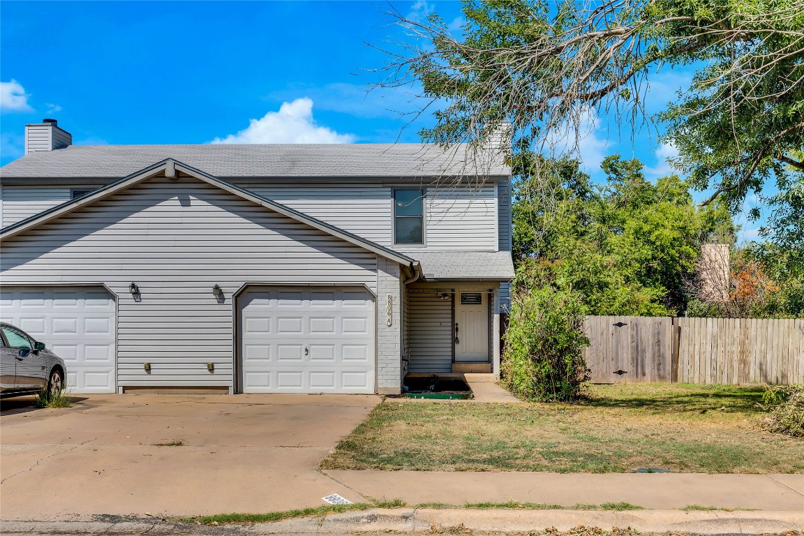 8806 Springmail Circle, Unit B Austin, TX 78729 - Photo 1 of 16 a view of garage with a small yard