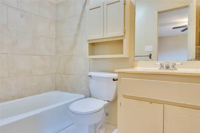 a bathroom with a sink a toilet and bathtub