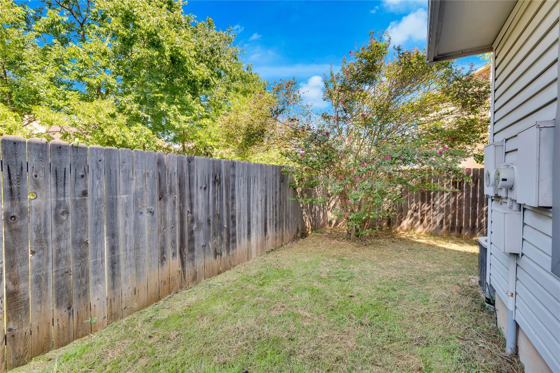 8806 Springmail Circle, Unit B Austin, TX 78729 - Photo 14 of 16 a view of backyard with wooden fence