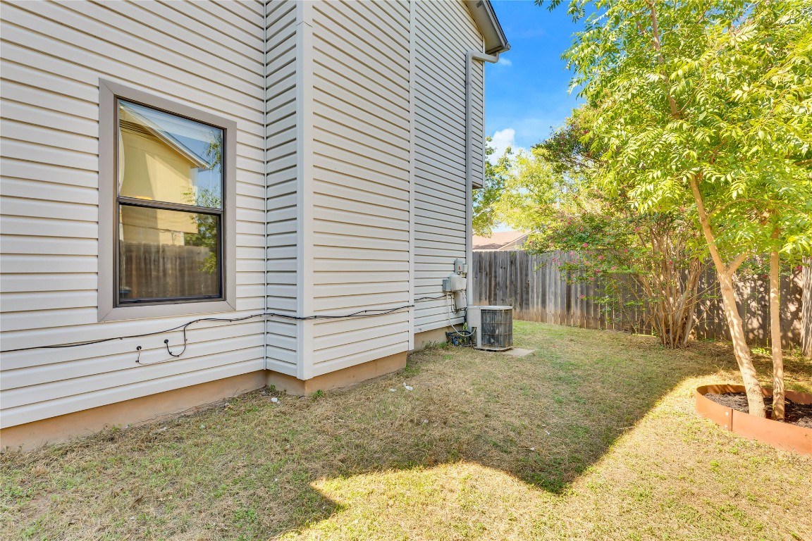 8806 Springmail Circle, Unit B Austin, TX 78729 - Photo 16 of 16 a view of a backyard with a tree