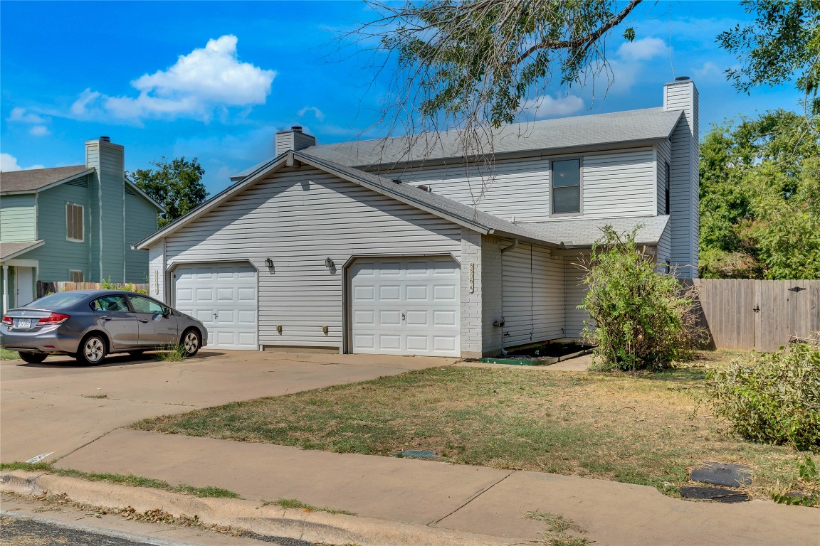 8806 Springmail Circle, Unit B Austin, TX 78729 - Photo 2 of 16 a view of a car in front of a house