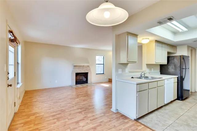 a kitchen with stainless steel appliances granite countertop a stove and a sink