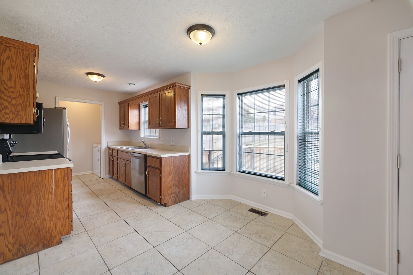 244 Green Hills Drive Springfield, TN 37172 - Photo 4 of 18 a kitchen with stainless steel appliances granite countertop a stove a sink and a refrigerator