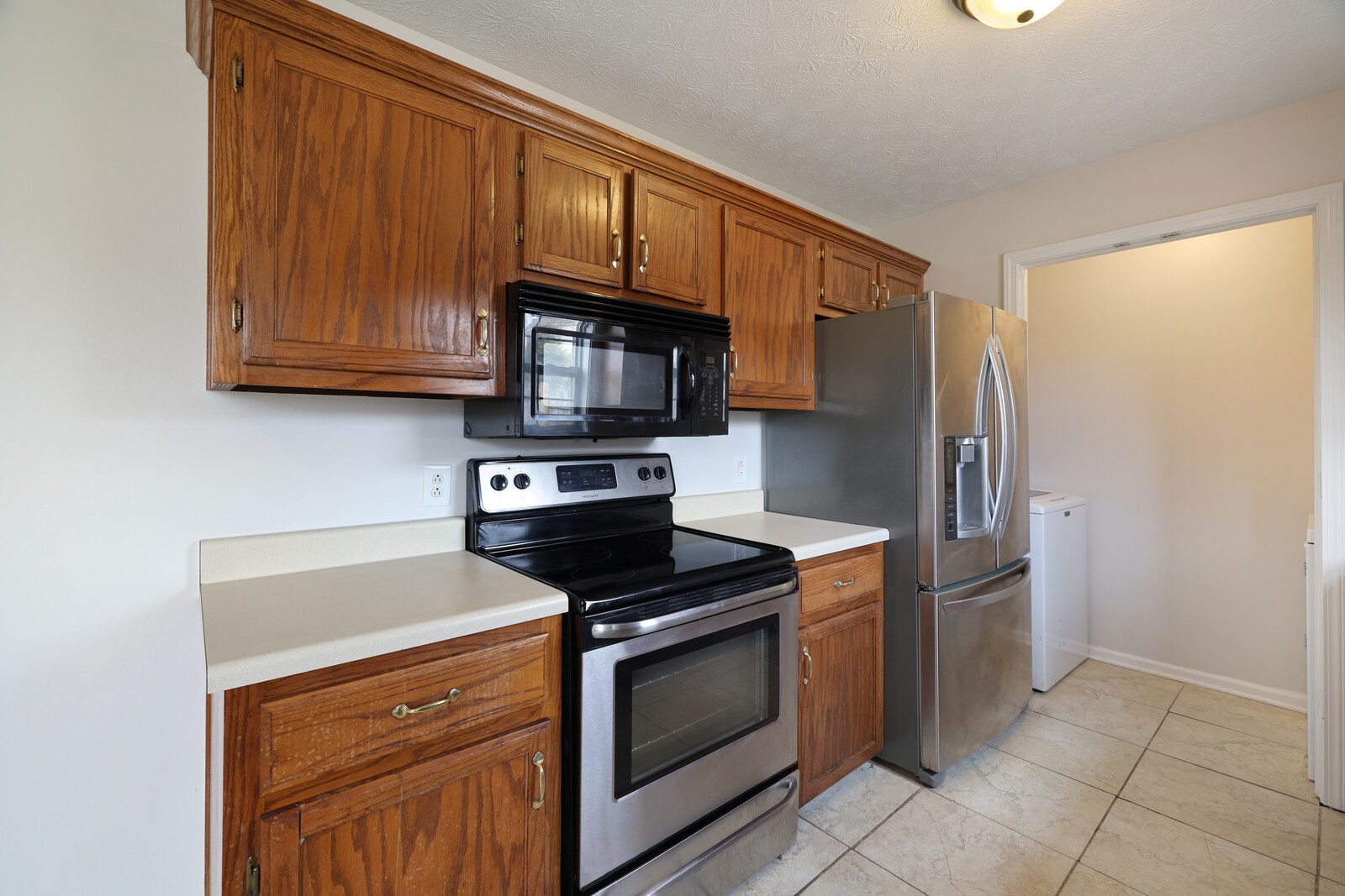 244 Green Hills Drive Springfield, TN 37172 - Photo 6 of 18 a kitchen with stainless steel appliances granite countertop a stove microwave and refrigerator