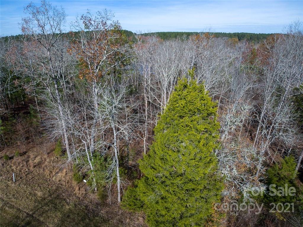 331 Terrapin Pointe Road, Unit 19 Hodges, SC 29653 - Photo 9 of 13 a view of a garden with a building