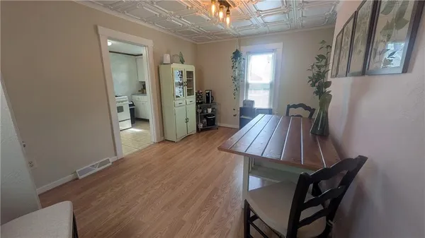 a view of a livingroom with furniture and hardwood floor