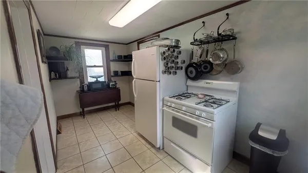 a kitchen with a stove and a refrigerator