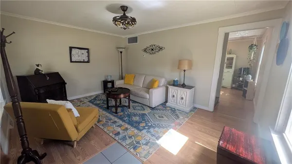 a living room with furniture and a rug