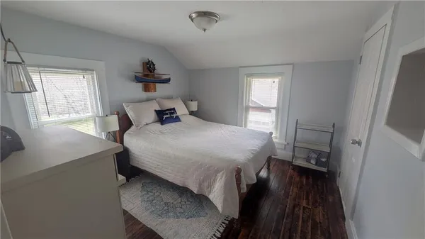 a bedroom with a bed and a table