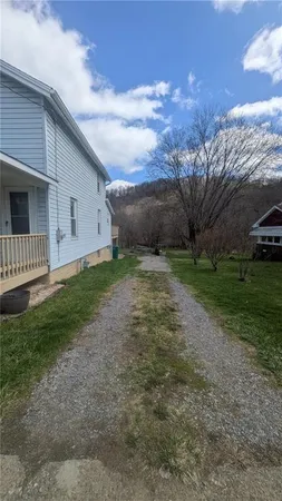 a view of a backyard with green space