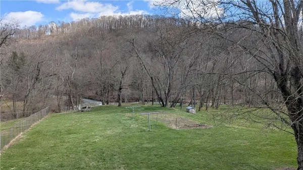 a backyard of a house with lots of green space