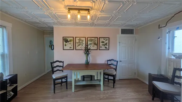 a dining room with furniture and window