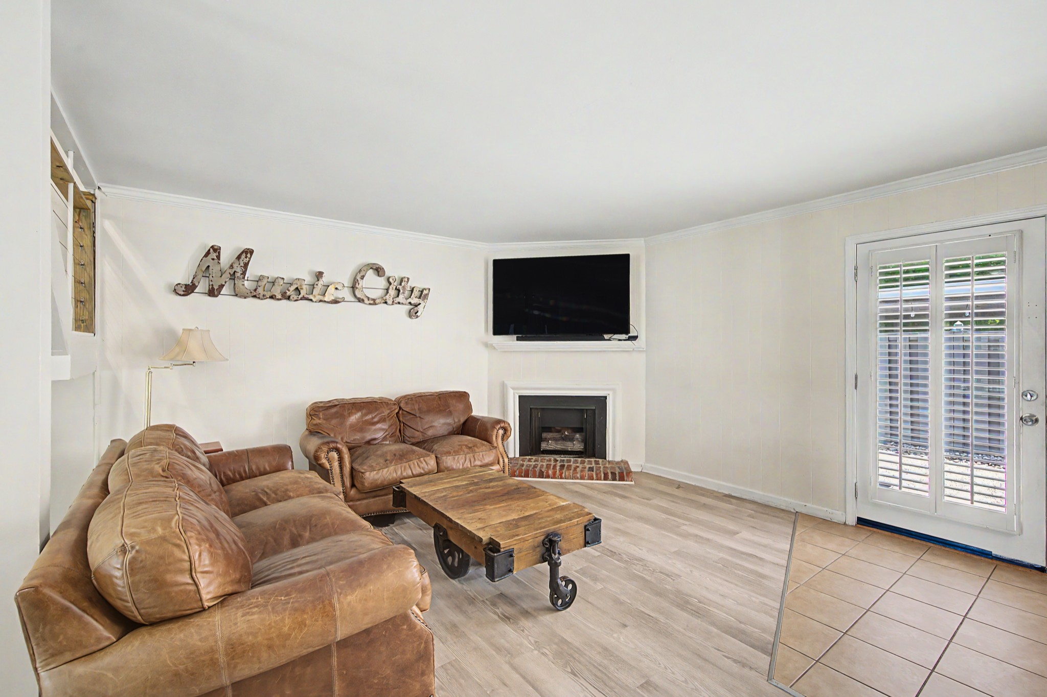 8300 Sawyer Brown Road, Unit A304 Nashville, TN 37221 - Photo 18 of 57 a living room with furniture and a flat screen tv