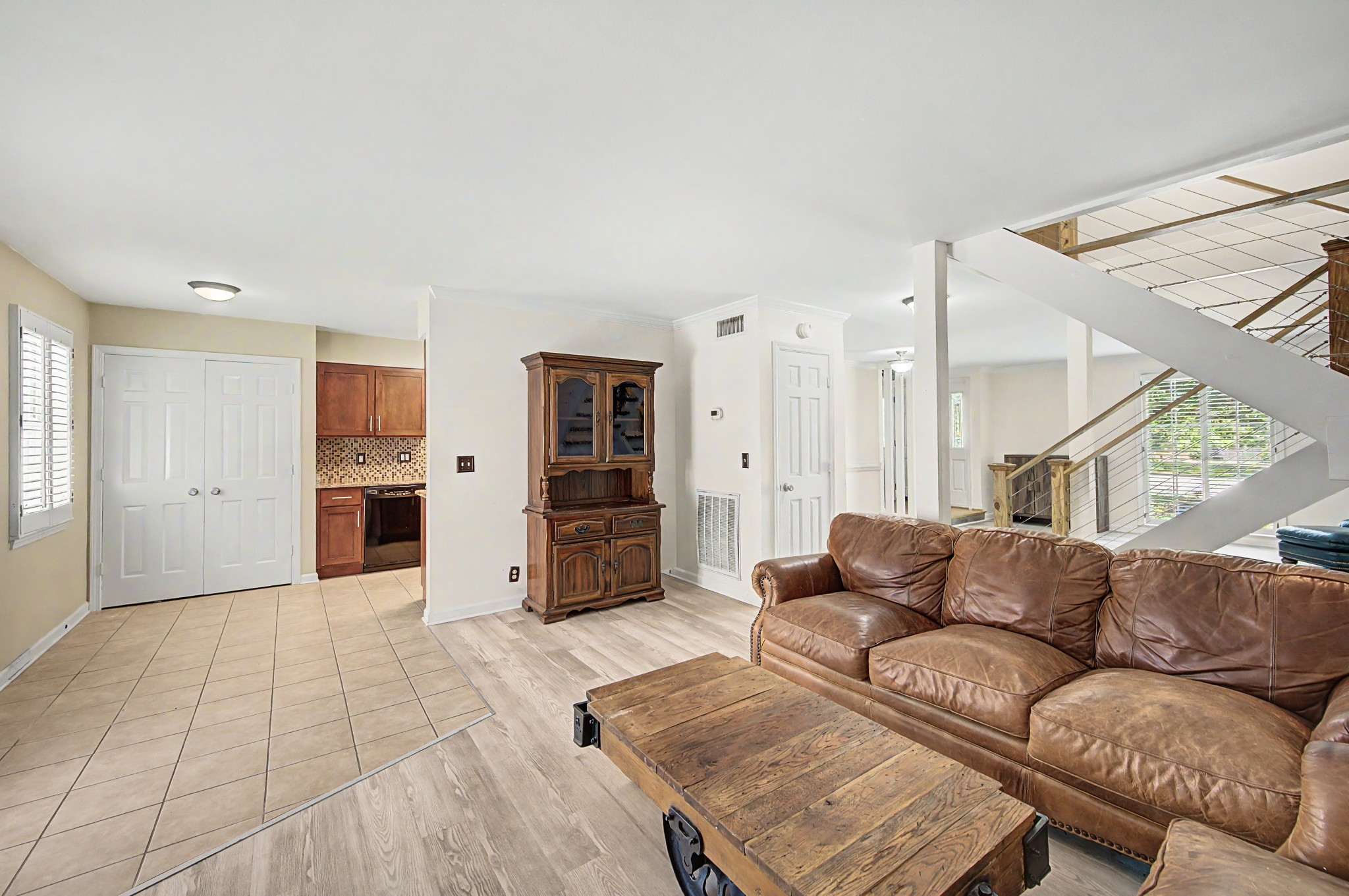 8300 Sawyer Brown Road, Unit A304 Nashville, TN 37221 - Photo 20 of 57 a living room with furniture and a open kitchen view