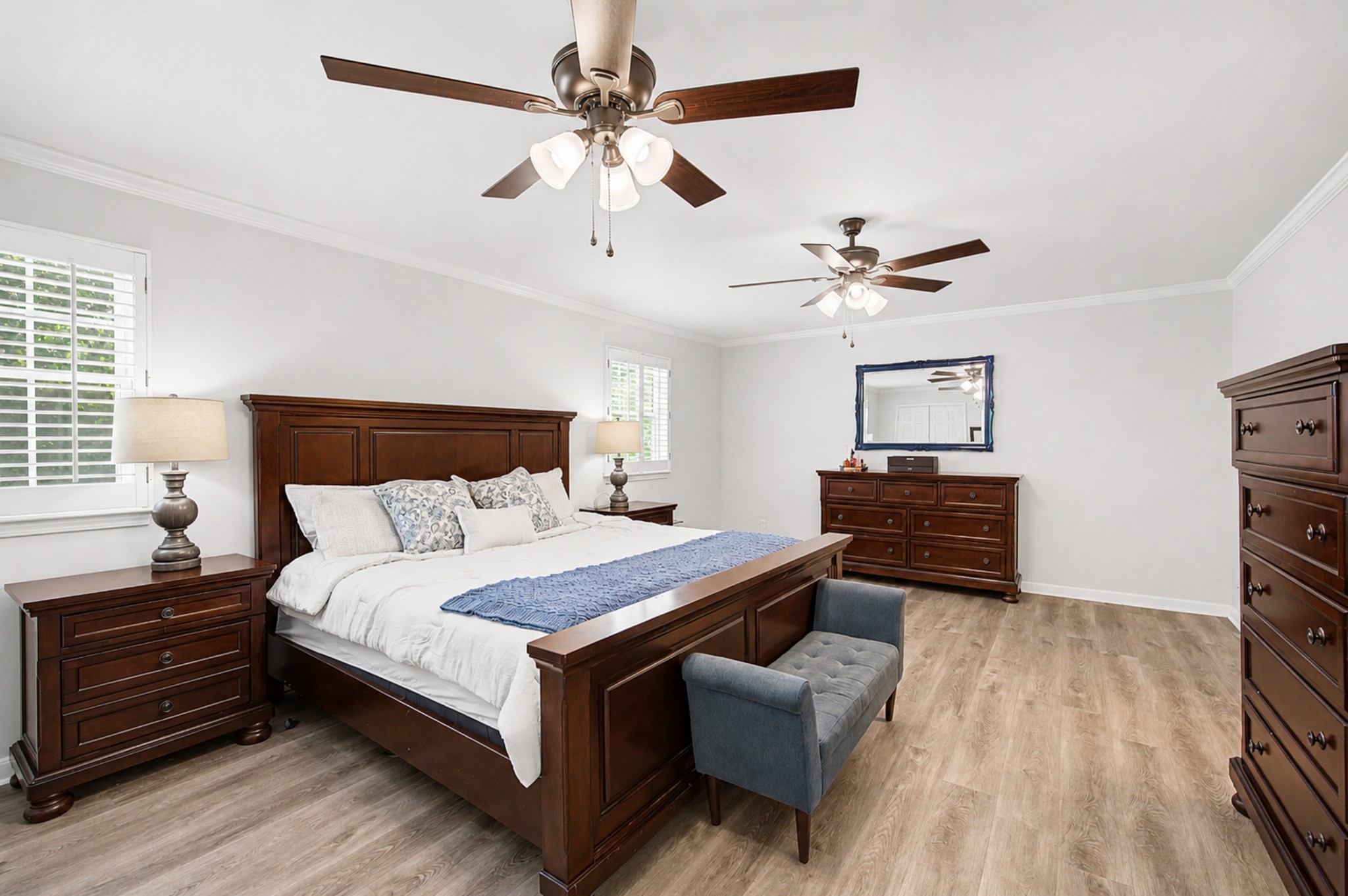8300 Sawyer Brown Road, Unit A304 Nashville, TN 37221 - Photo 30 of 57 a bedroom with a bed and a ceiling fan