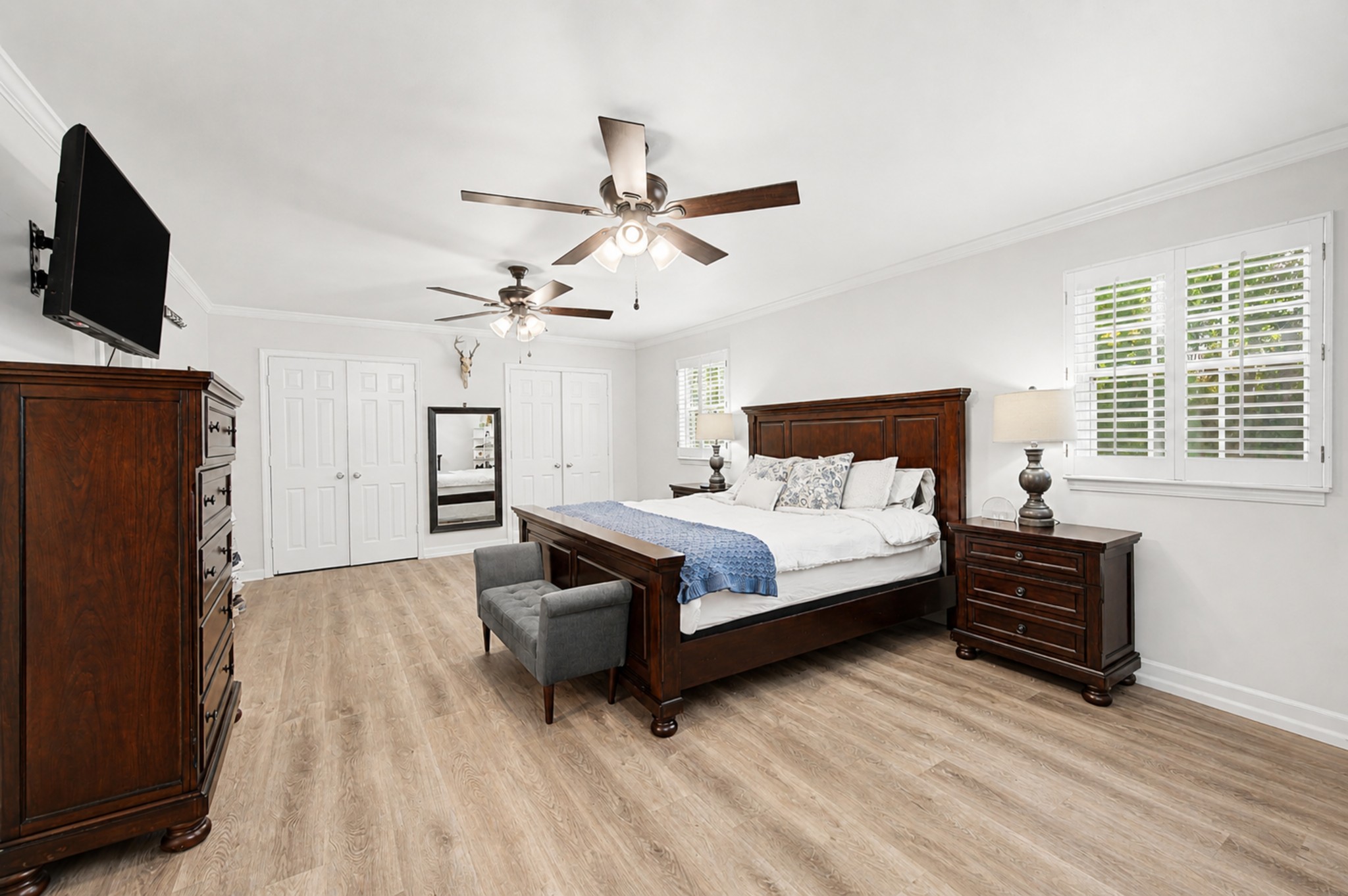 8300 Sawyer Brown Road, Unit A304 Nashville, TN 37221 - Photo 31 of 57 a bedroom with a bed closet and flat tv screen