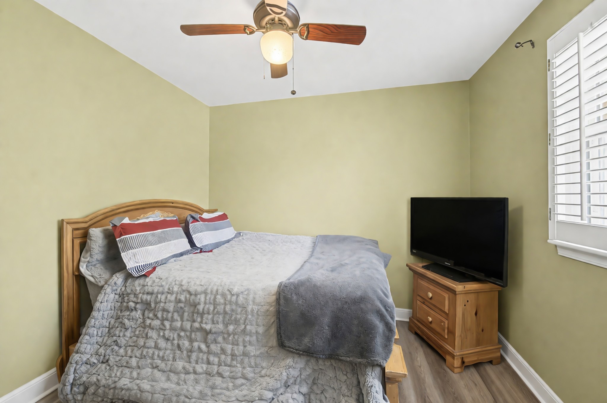 8300 Sawyer Brown Road, Unit A304 Nashville, TN 37221 - Photo 36 of 57 a bedroom with a bed and a flat screen tv