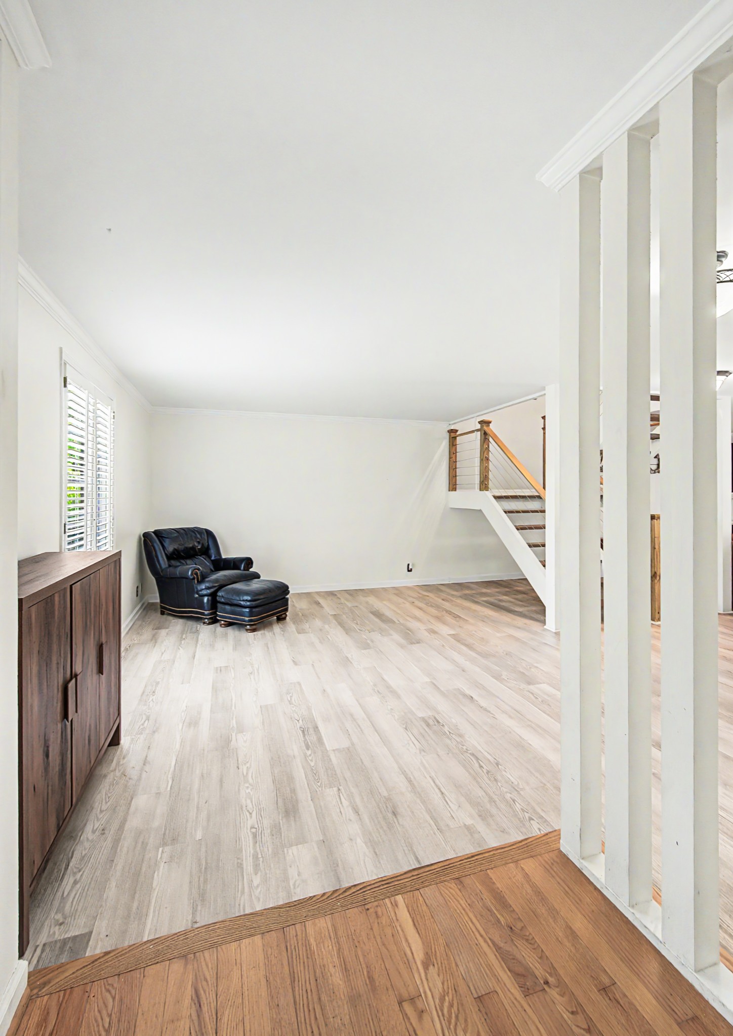 8300 Sawyer Brown Road, Unit A304 Nashville, TN 37221 - Photo 8 of 57 a view of a bedroom with wooden floor and closet
