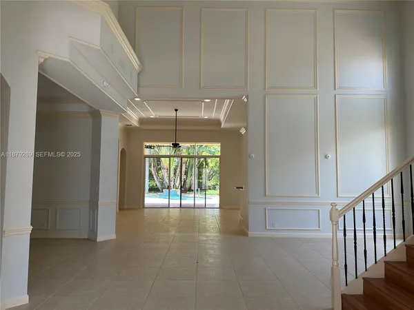 a view of an entryway with a hallway