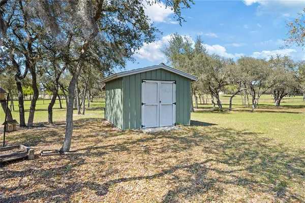 a view of outdoor space with swimming pool and green space