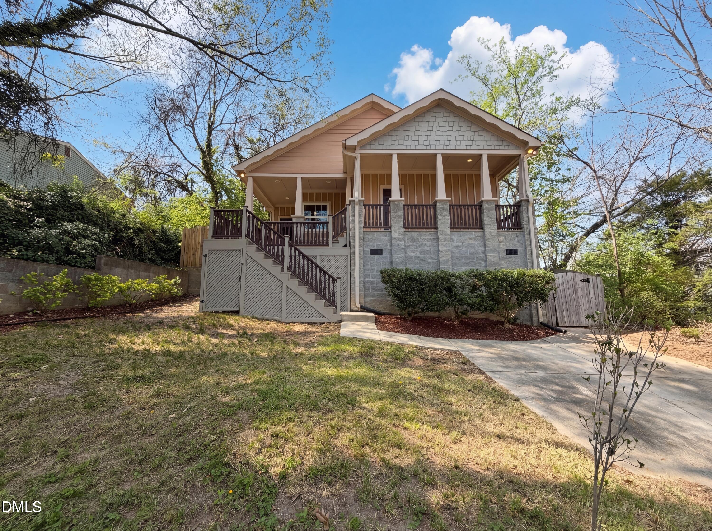 1007 Hazel Street Durham, NC 27701 - Photo 1 of 17 a front view of a house with a yard and garage