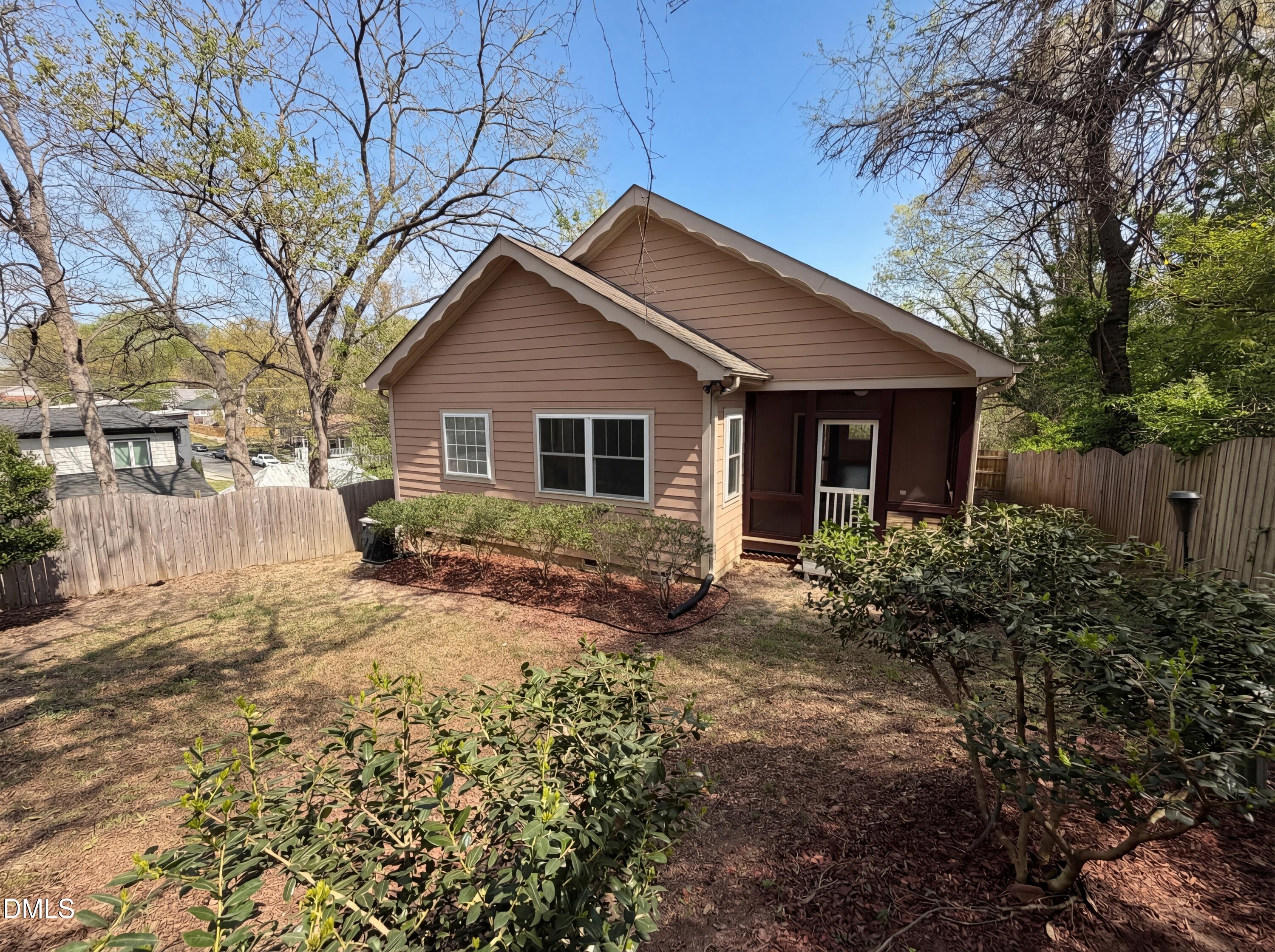 1007 Hazel Street Durham, NC 27701 - Photo 5 of 17 a view of a yard in front of a house with large tree