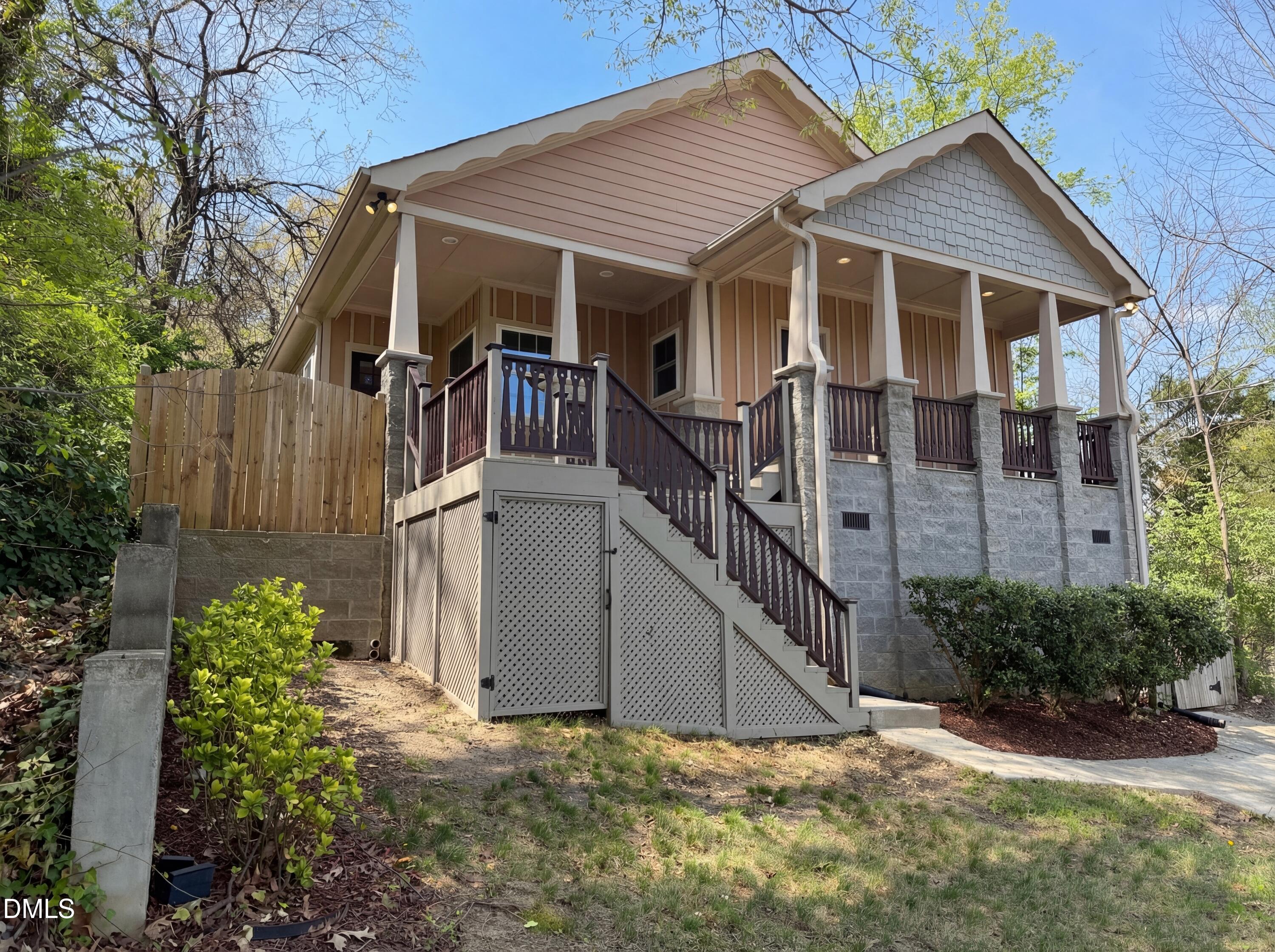 1007 Hazel Street Durham, NC 27701 - Photo 7 of 17 a view of a small house with wooden fence