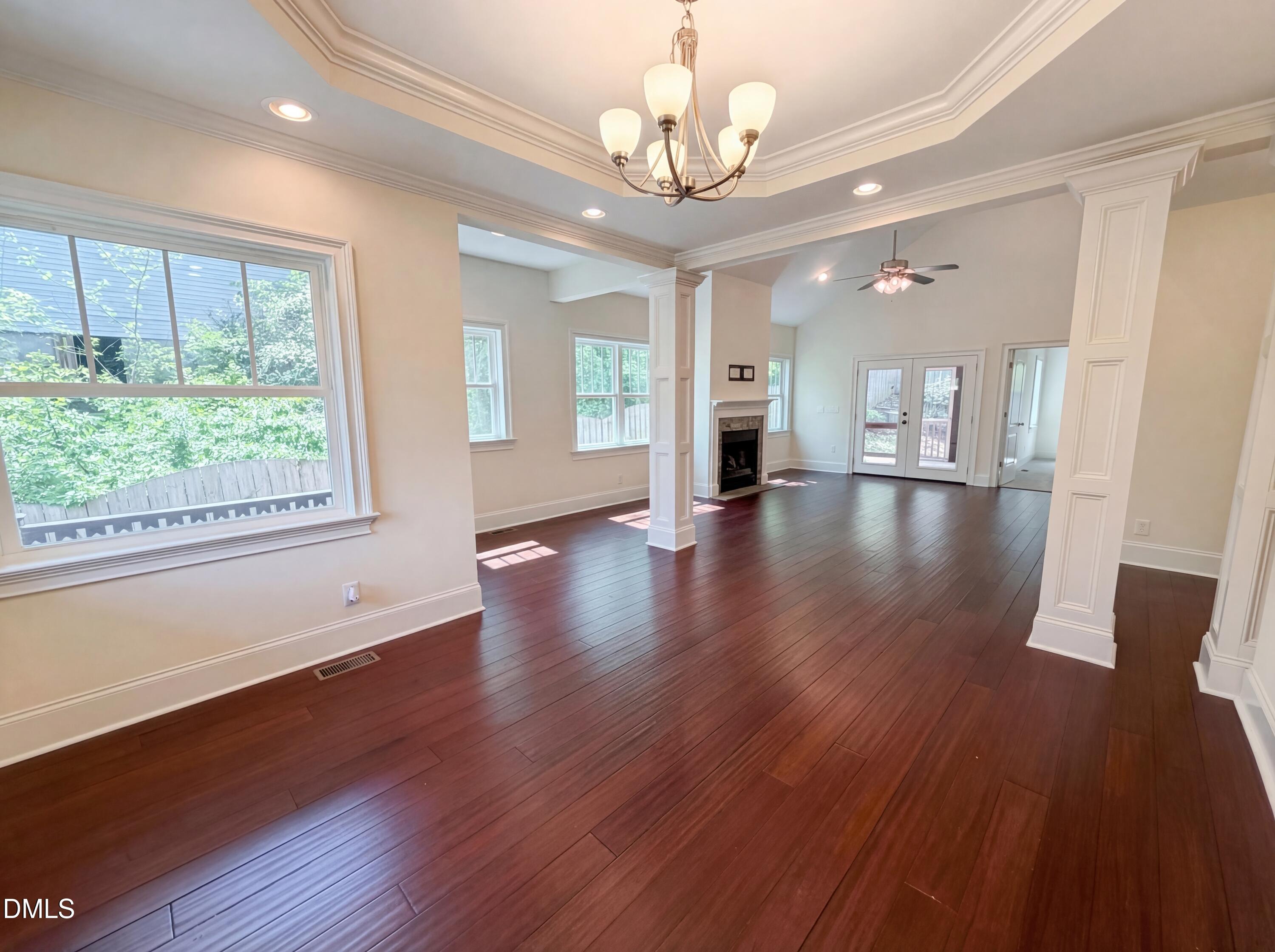 1007 Hazel Street Durham, NC 27701 - Photo 8 of 17 a view of an empty room with wooden floor and a window