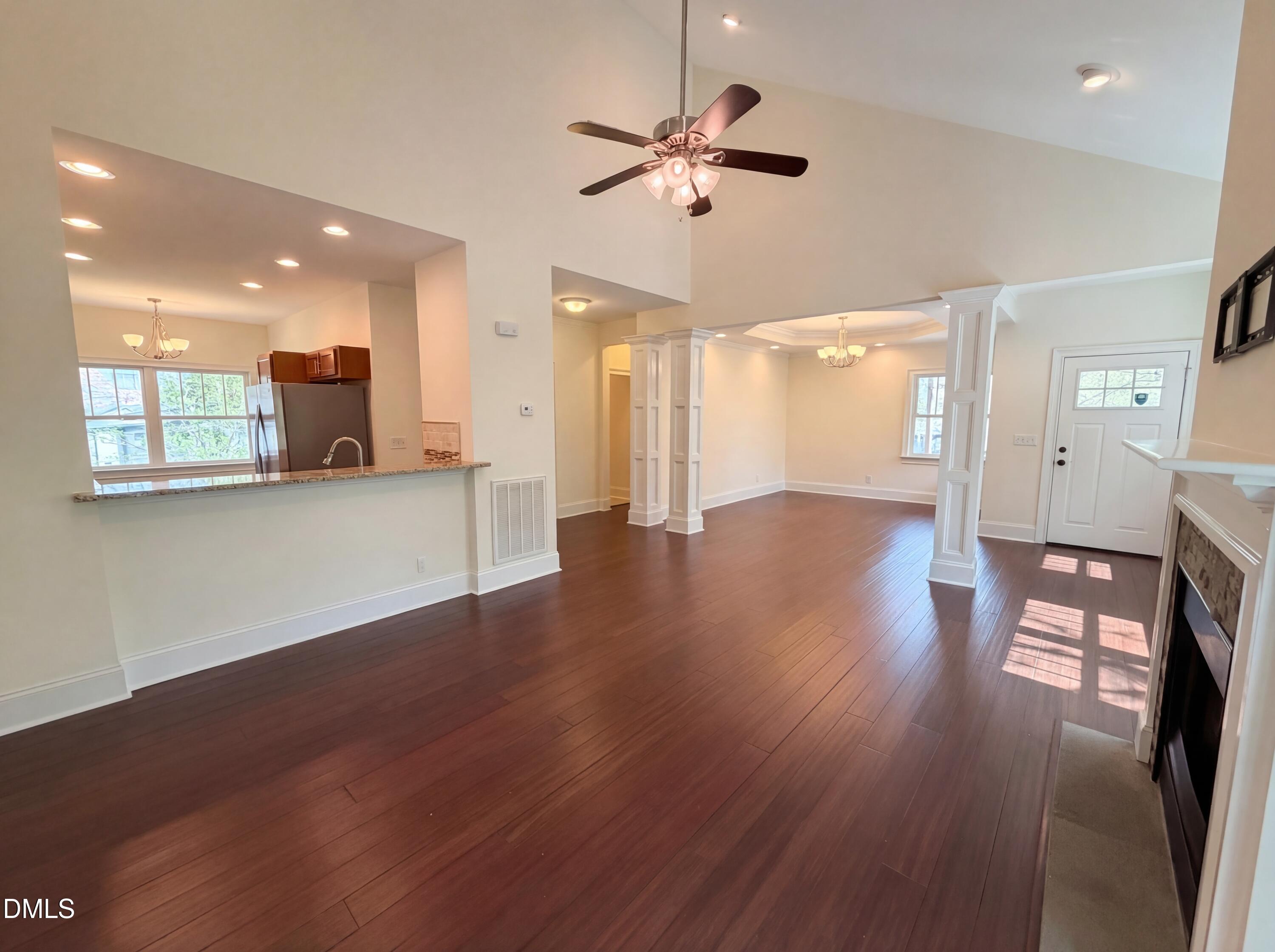1007 Hazel Street Durham, NC 27701 - Photo 10 of 17 a view of a livingroom with hardwood floor and a ceiling fan