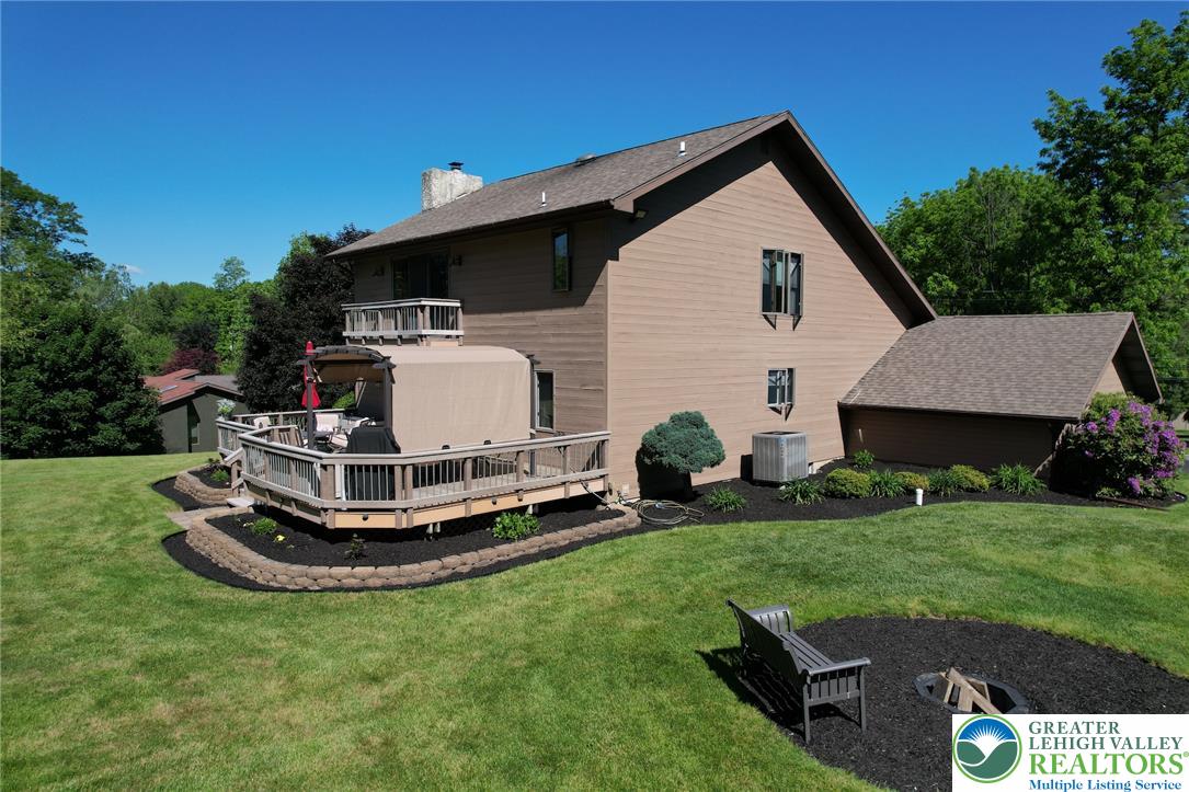 3470 Brodhead Road Bethlehem, PA 18020 - Photo 22 of 84 An inviting backyard deck perfect for entertaining, with a fire pit area for evening gatherings.