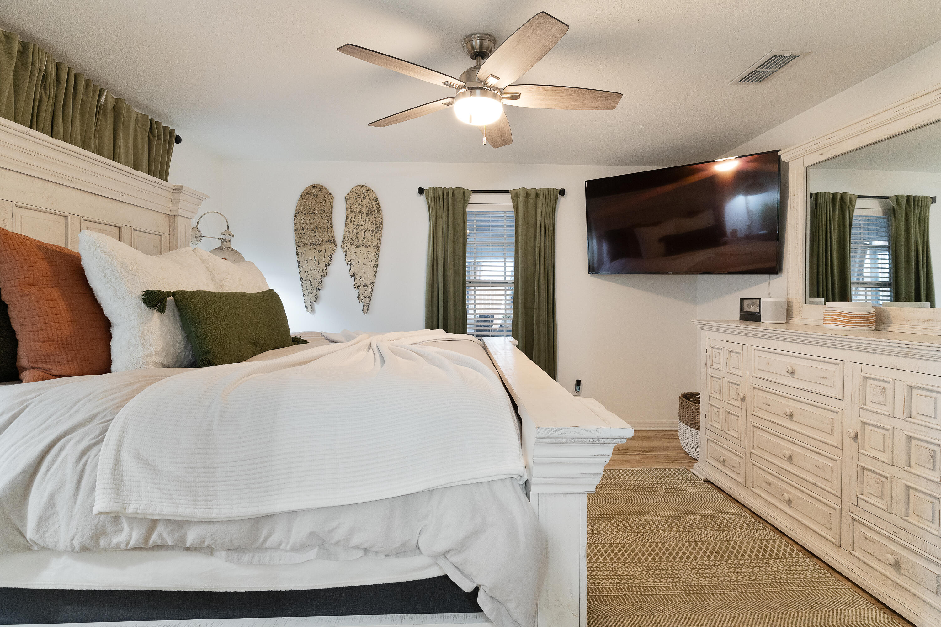 125 Wright Circle Niceville, FL 32578 - Photo 22 of 51 a bedroom with a large bed and a flat screen tv