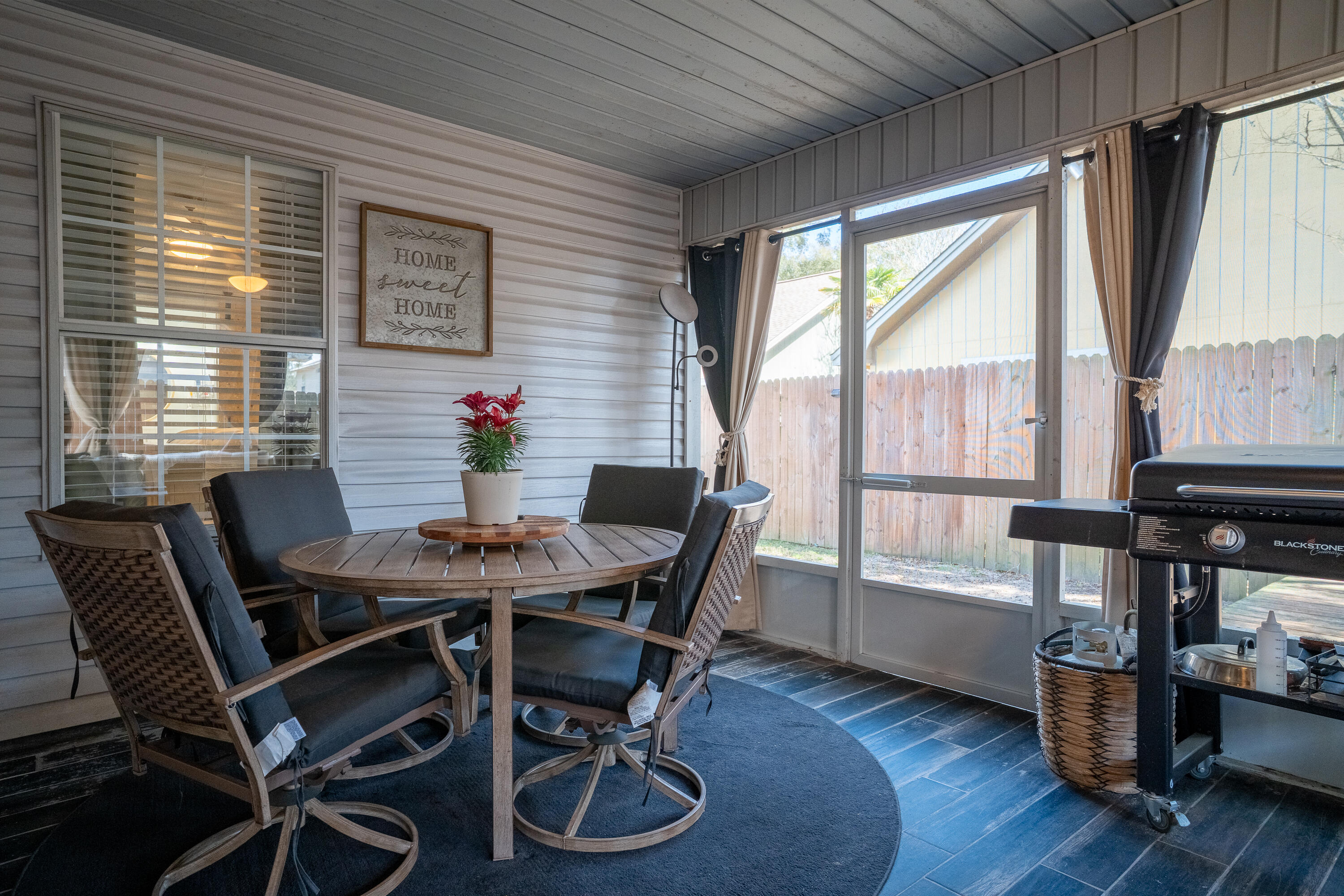 125 Wright Circle Niceville, FL 32578 - Photo 38 of 51 a view of a dining room with furniture window and wooden floor