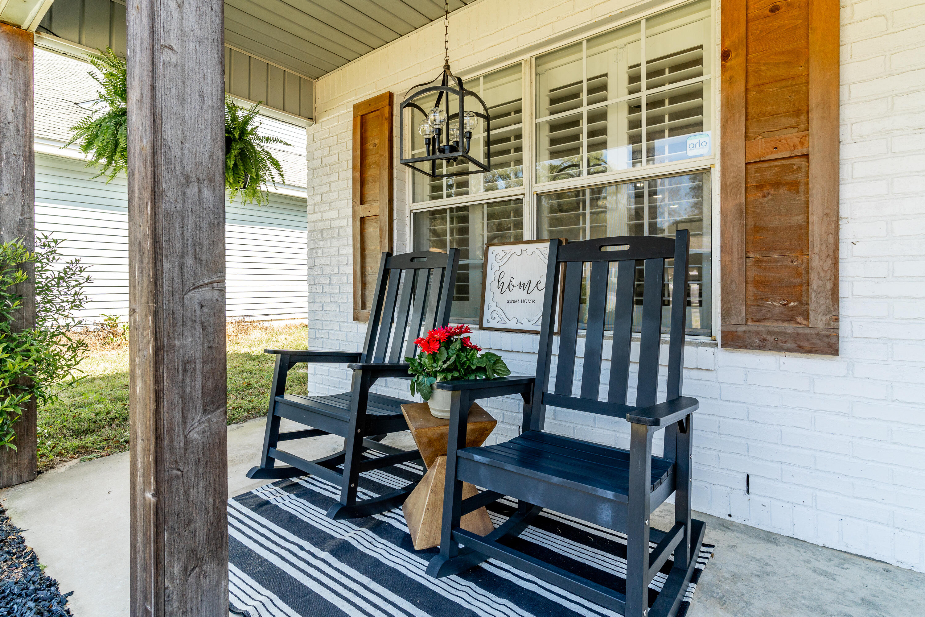 125 Wright Circle Niceville, FL 32578 - Photo 47 of 51 a view of balcony with two chairs and a potted plant