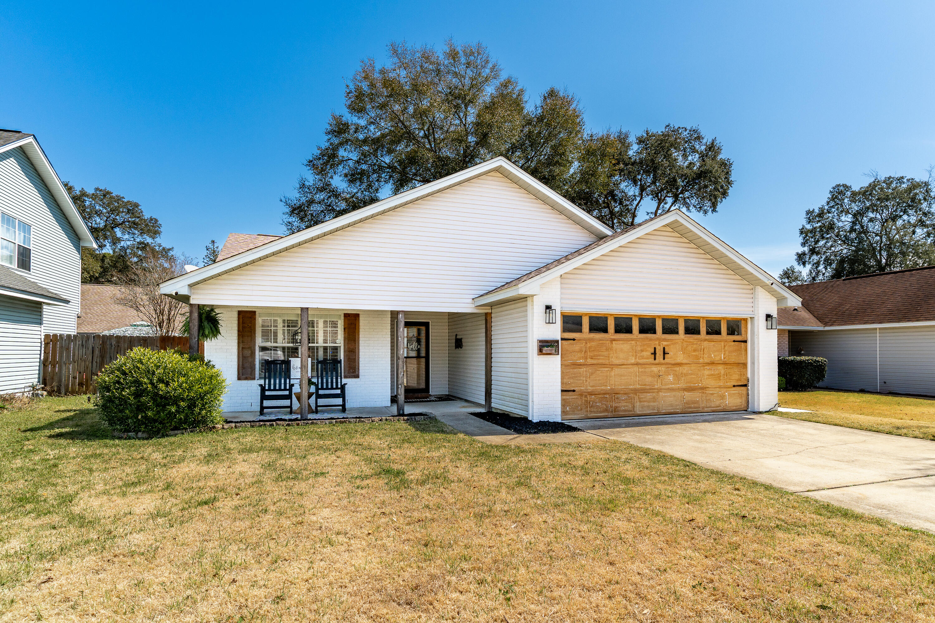 125 Wright Circle Niceville, FL 32578 - Photo 51 of 51 a front view of a house with a yard and garage
