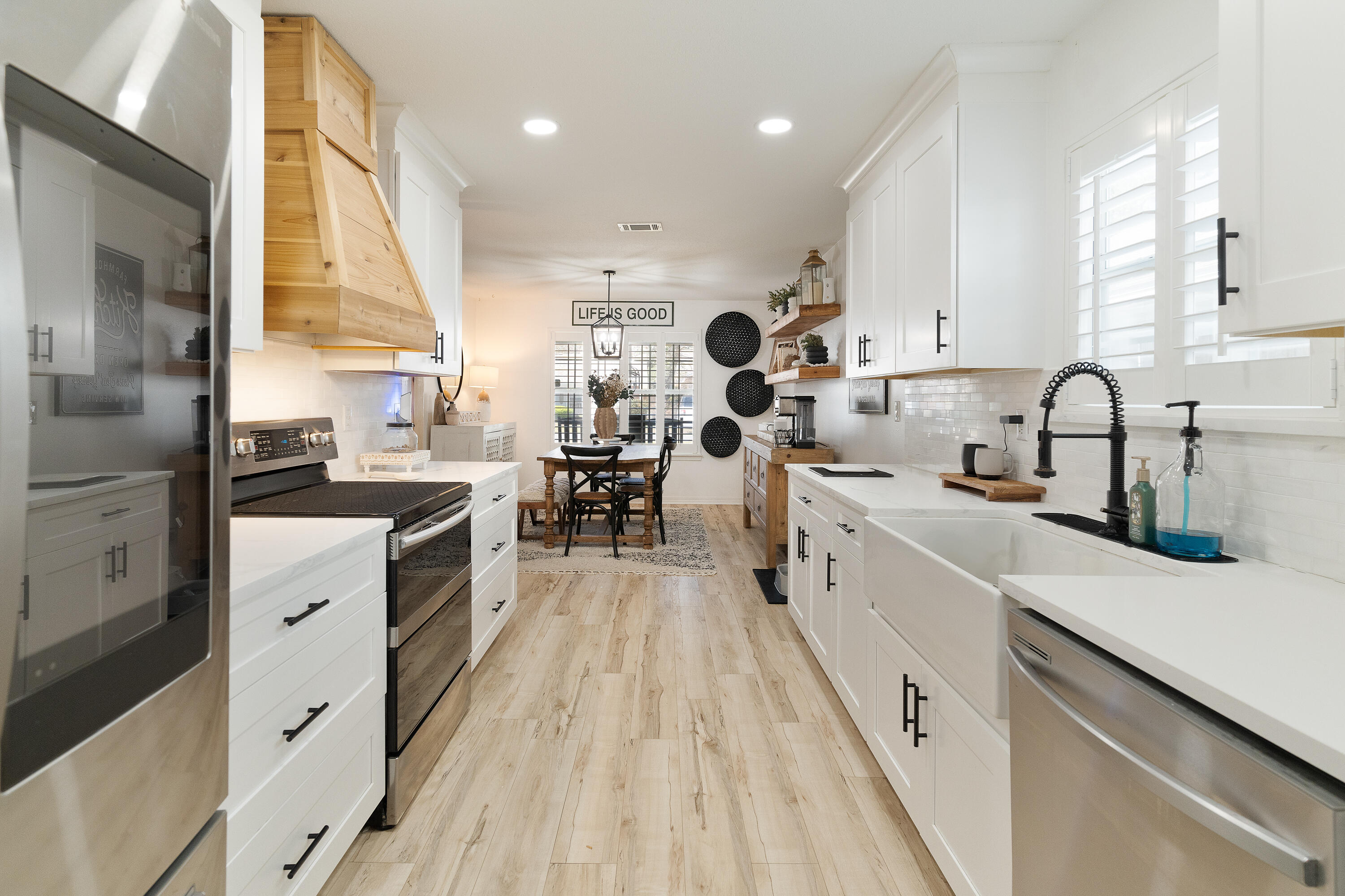 125 Wright Circle Niceville, FL 32578 - Photo 9 of 51 a kitchen with white cabinets appliances and sink