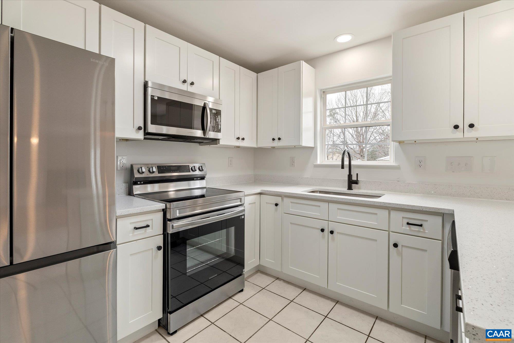 1600 Old Brook Road Charlottesville, VA 22901 - Photo 12 of 48 a kitchen with white cabinets stainless steel appliances and a window