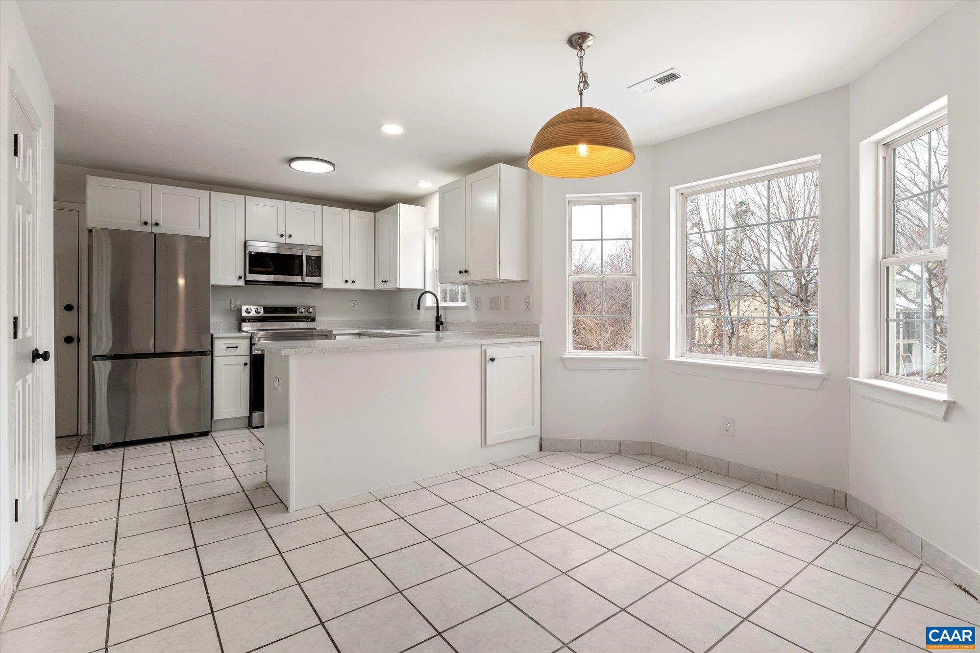 1600 Old Brook Road Charlottesville, VA 22901 - Photo 14 of 48 a kitchen with stainless steel appliances granite countertop a stove a sink dishwasher a refrigerator and a microwave oven with cabinets