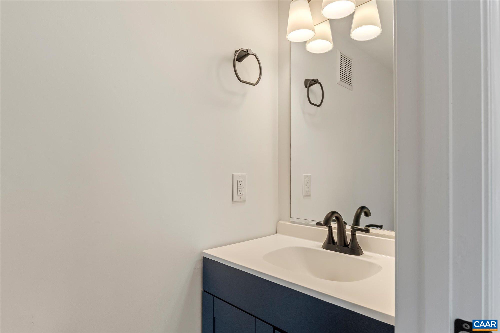1600 Old Brook Road Charlottesville, VA 22901 - Photo 17 of 48 a bathroom with a sink and mirror