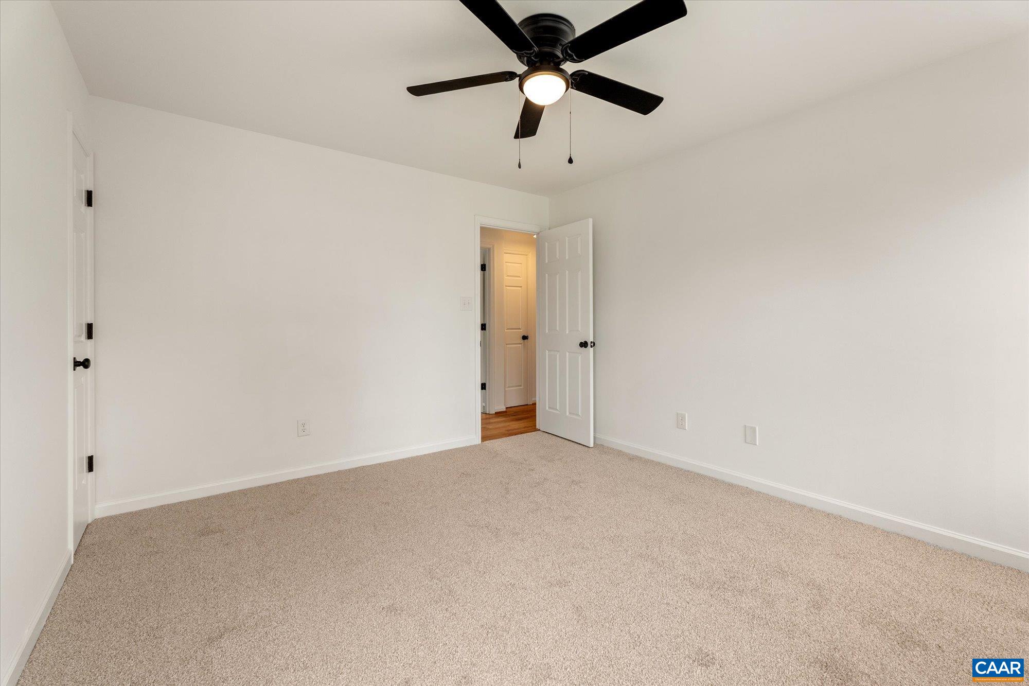1600 Old Brook Road Charlottesville, VA 22901 - Photo 27 of 48 an empty room with a ceiling fan and a window