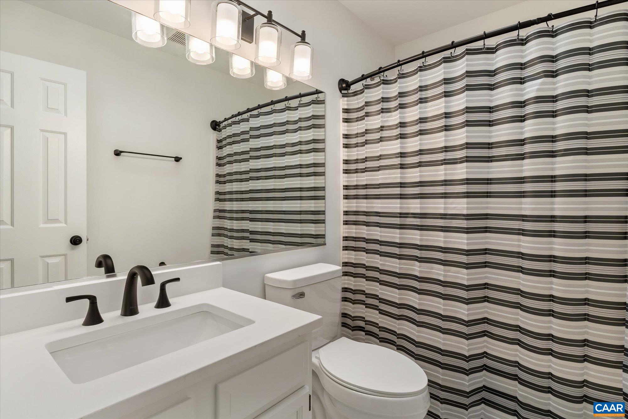 1600 Old Brook Road Charlottesville, VA 22901 - Photo 28 of 48 a bathroom with a sink a toilet and mirror