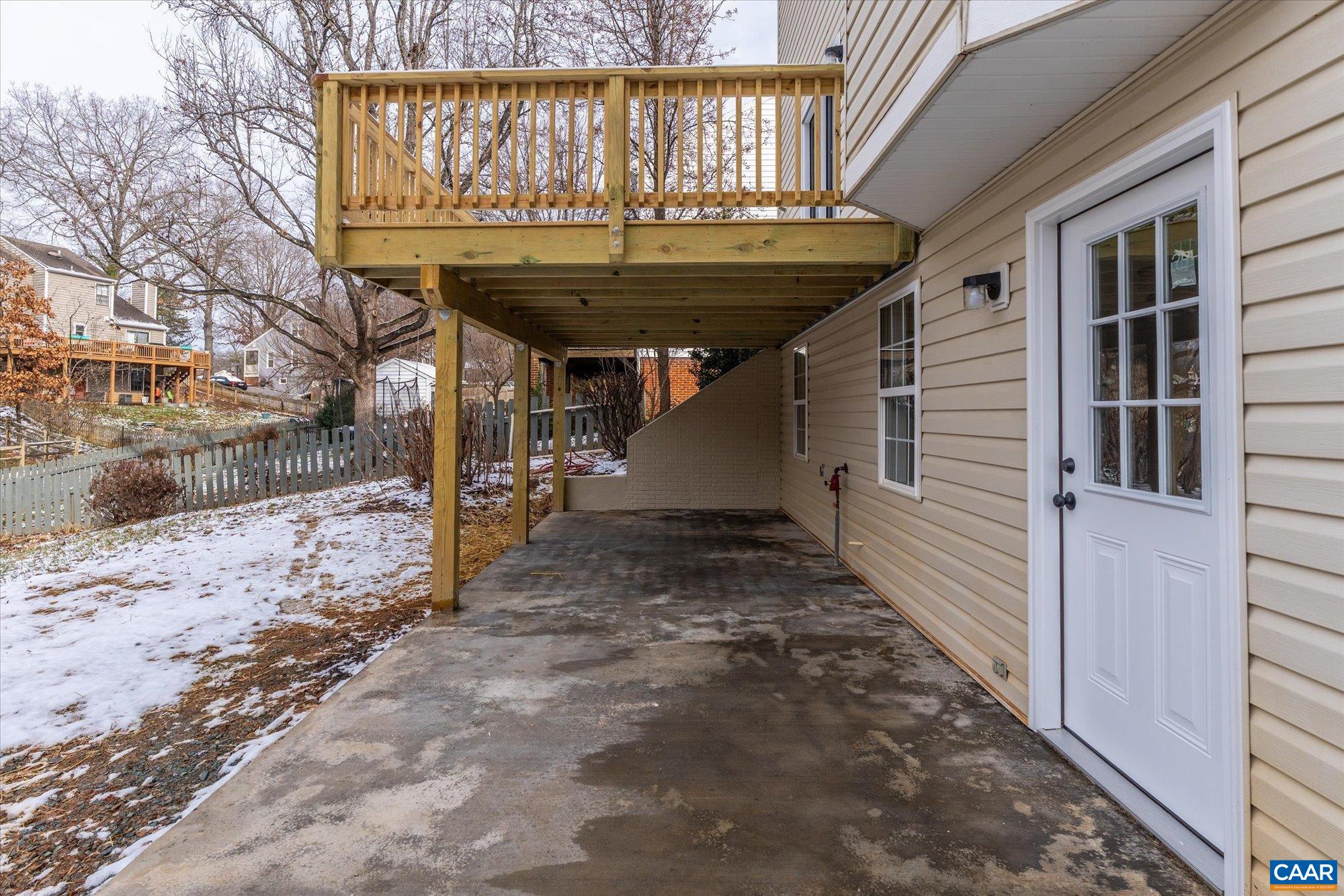 1600 Old Brook Road Charlottesville, VA 22901 - Photo 39 of 48 a view of a backyard with a table and chairs and wooden fence