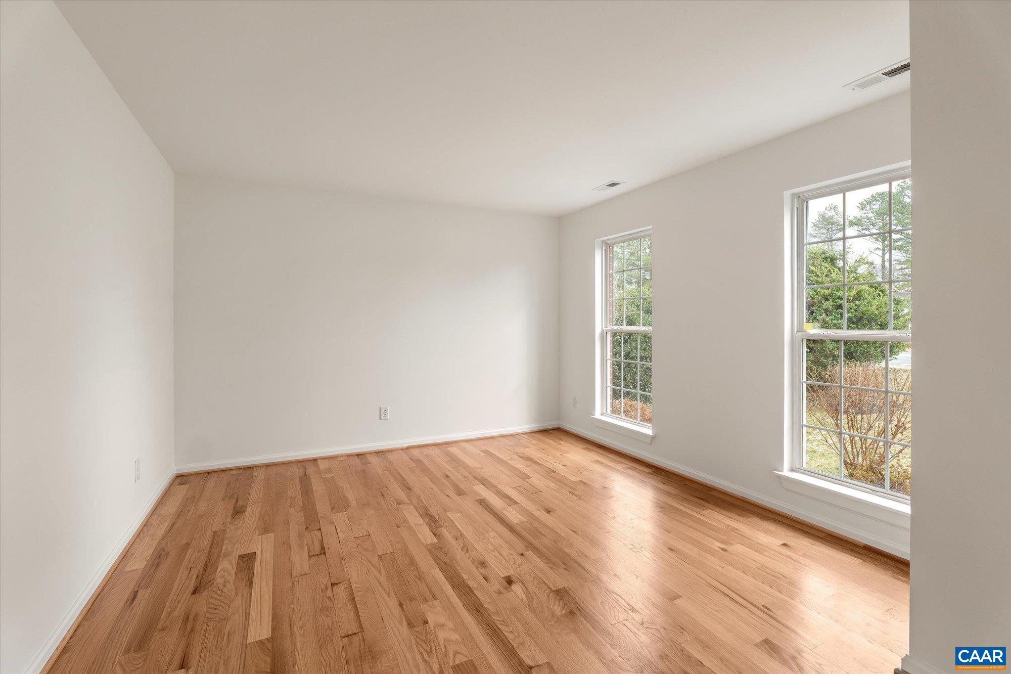 1600 Old Brook Road Charlottesville, VA 22901 - Photo 6 of 48 wooden floor in an empty room with a window
