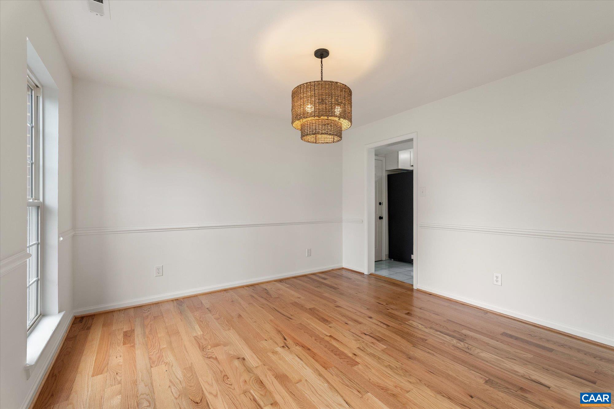 1600 Old Brook Road Charlottesville, VA 22901 - Photo 8 of 48 an empty room with wooden floor and windows