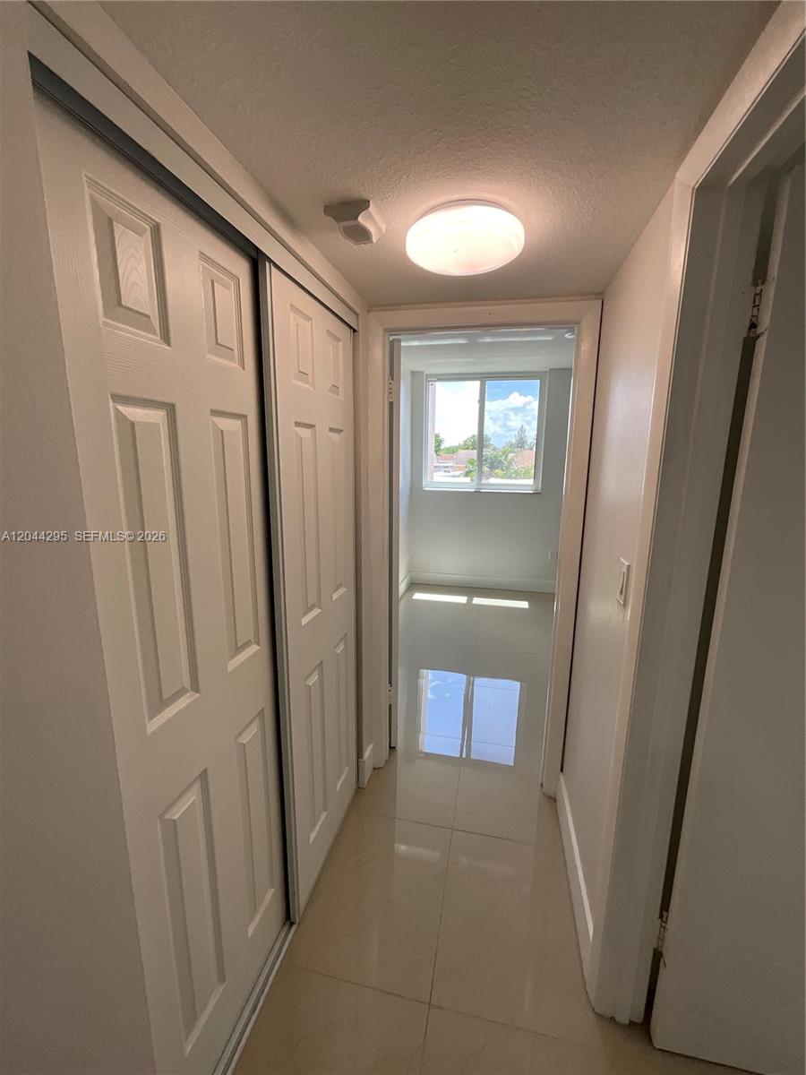 9441 Southwest 4th Street, Unit 214 Miami, FL 33174 - Photo 13 of 22 a view of entryway with a hallway