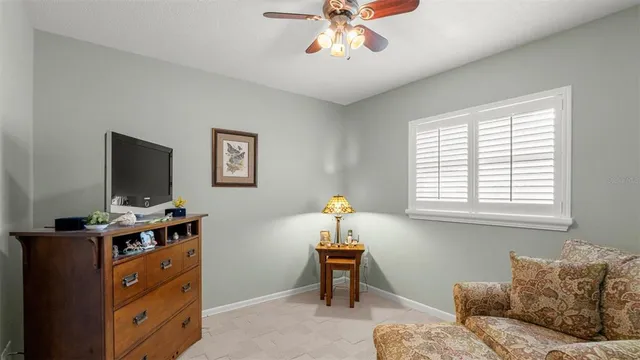 a bedroom with furniture and a window