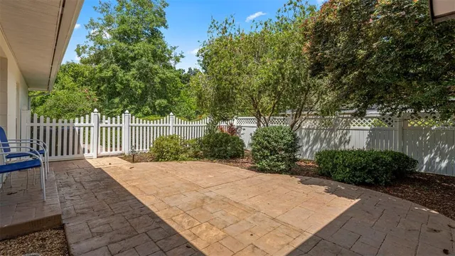 a view of house with backyard and porch
