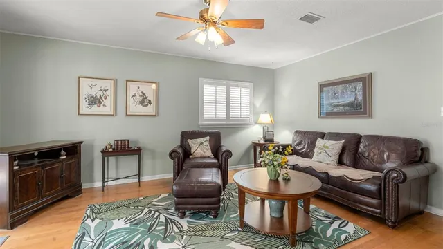 a living room with furniture a dining table and a fireplace
